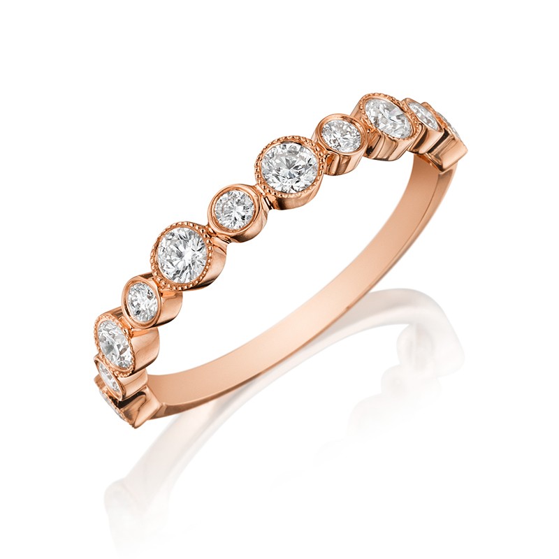 Henri Daussi rose gold band featuring a single line of round brilliant bezel set white diamonds with milgain detail.