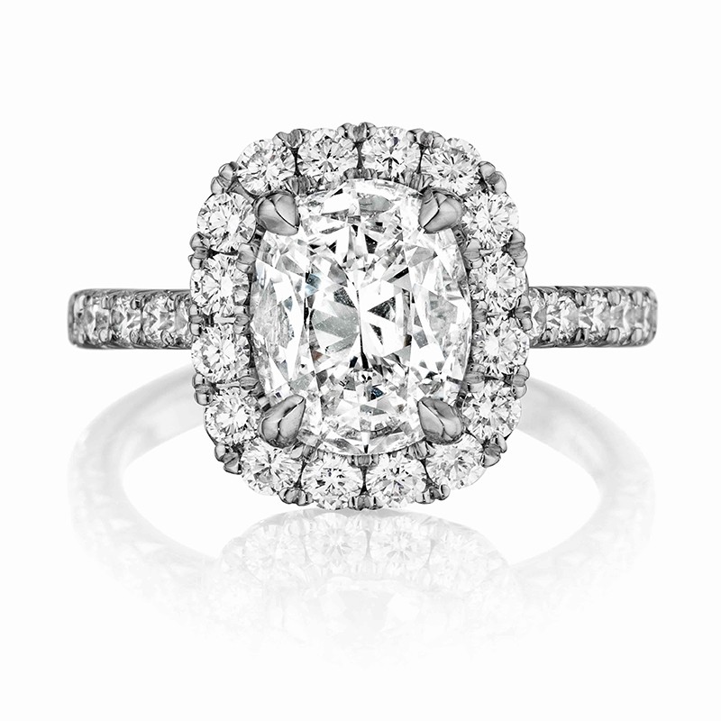 Henri Daussi cushion halo single shank diamond engagement  ring featuring a Signature Daussi Cushion cut diamond.  Set in 18kt white gold.