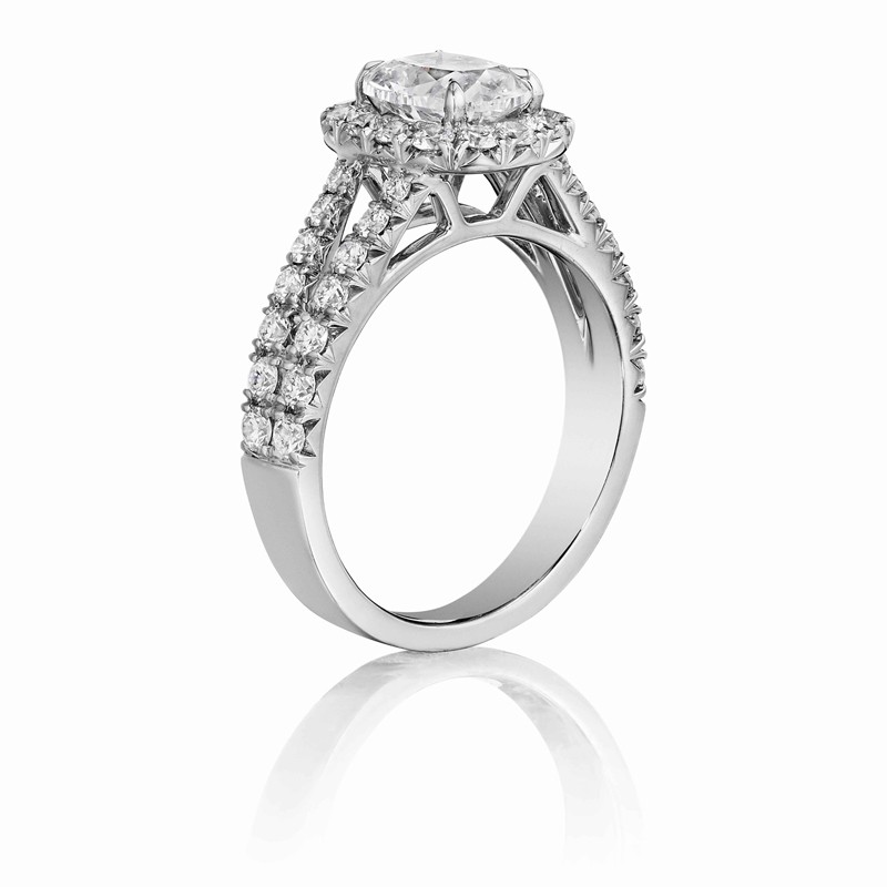 Henri Daussi cushion halo split shank diamond engagement ring featuring a Signature Daussi Cushion cut diamond.  Set in 18kt white gold.