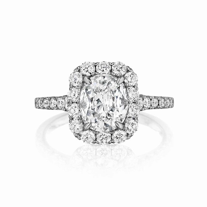 Henri Daussi cushion halo single graduated diamond shank engagement ring featuring a Signature Daussi Cushion cut diamond.  Set in 18kt white gold.