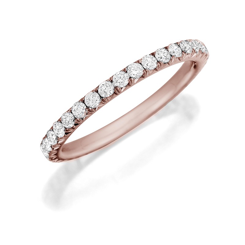 Henri Daussi rose gold band featuring a single line of round brilliant white diamonds.